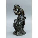A patinated bronze model of a girl with conch shell,