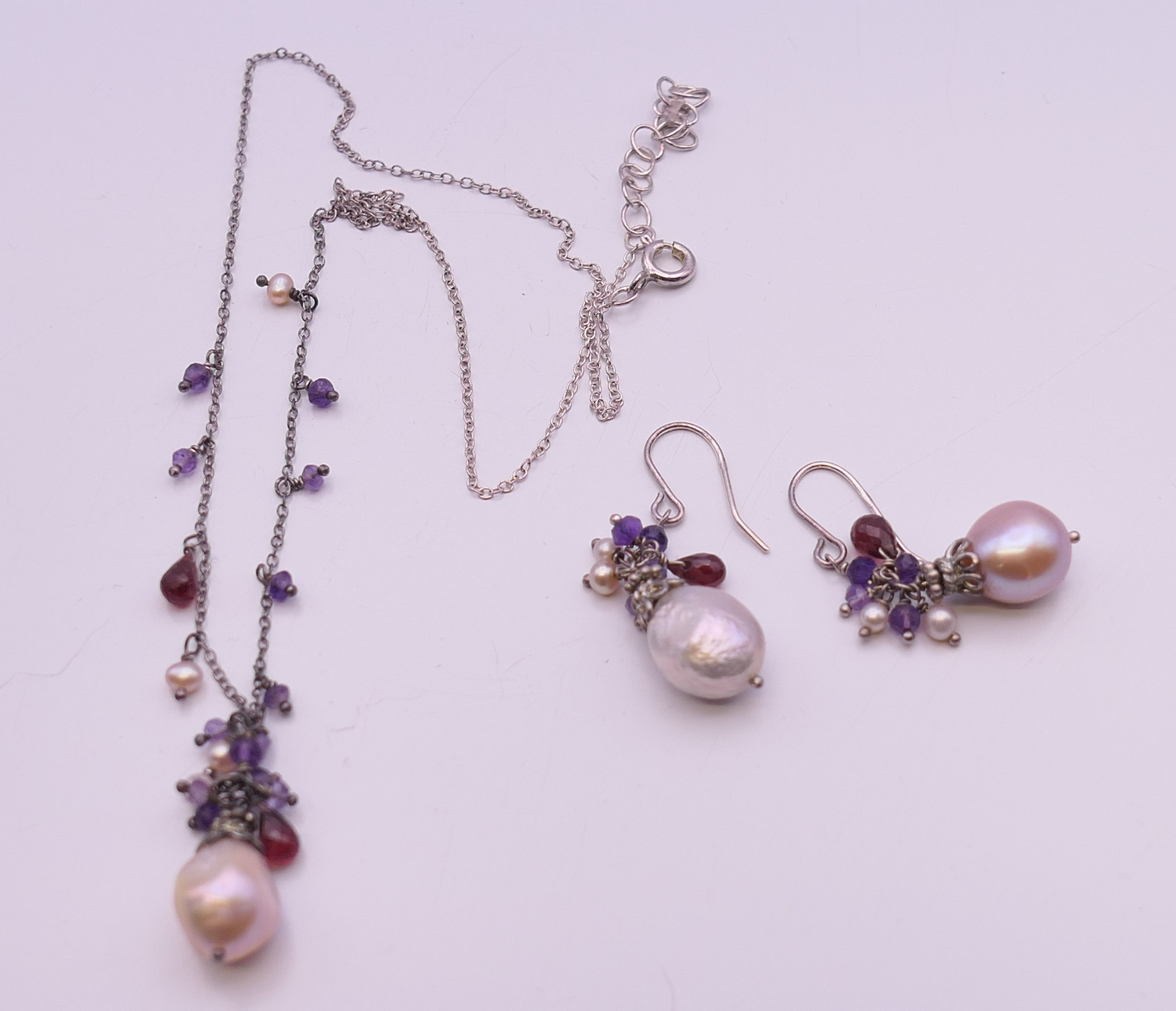 A pearl set necklace on a silver chain and a pair of matching earrings. - Image 4 of 5