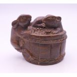 A netsuke formed as mice on a barrel. 3 cm high.