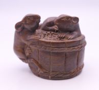 A netsuke formed as mice on a barrel. 3 cm high.