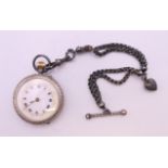 A silver fob watch on chain. 3.5 cm diameter, chain 16.5 cm long.