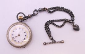 A silver fob watch on chain. 3.5 cm diameter, chain 16.5 cm long.