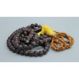 Two sets of Chinese prayer beads. The largest 134 cms long.