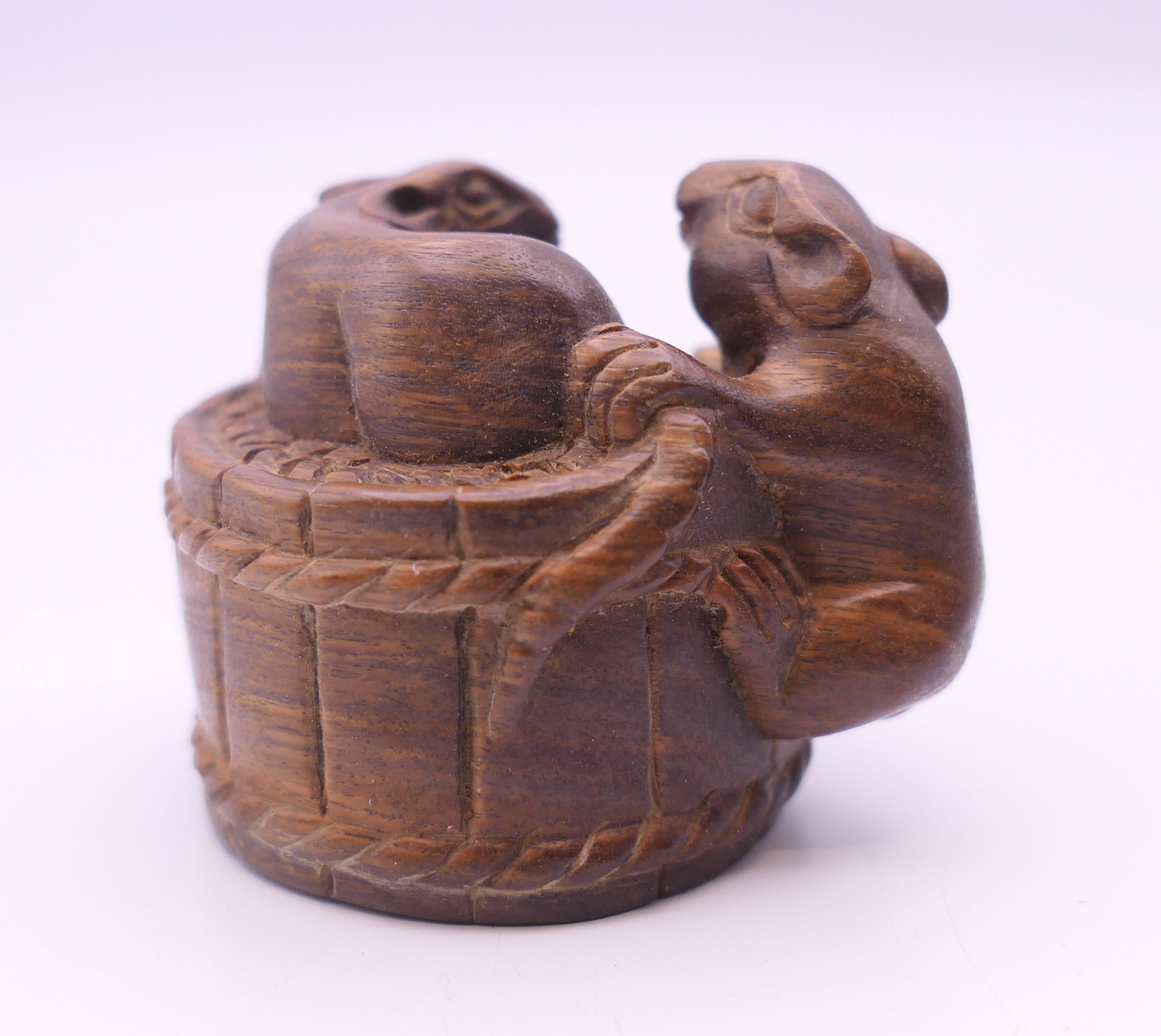 A netsuke formed as mice on a barrel. 3 cm high. - Image 2 of 3