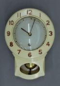 A 1950s Smiths Enfield kitchen wall clock. 25 cm high.