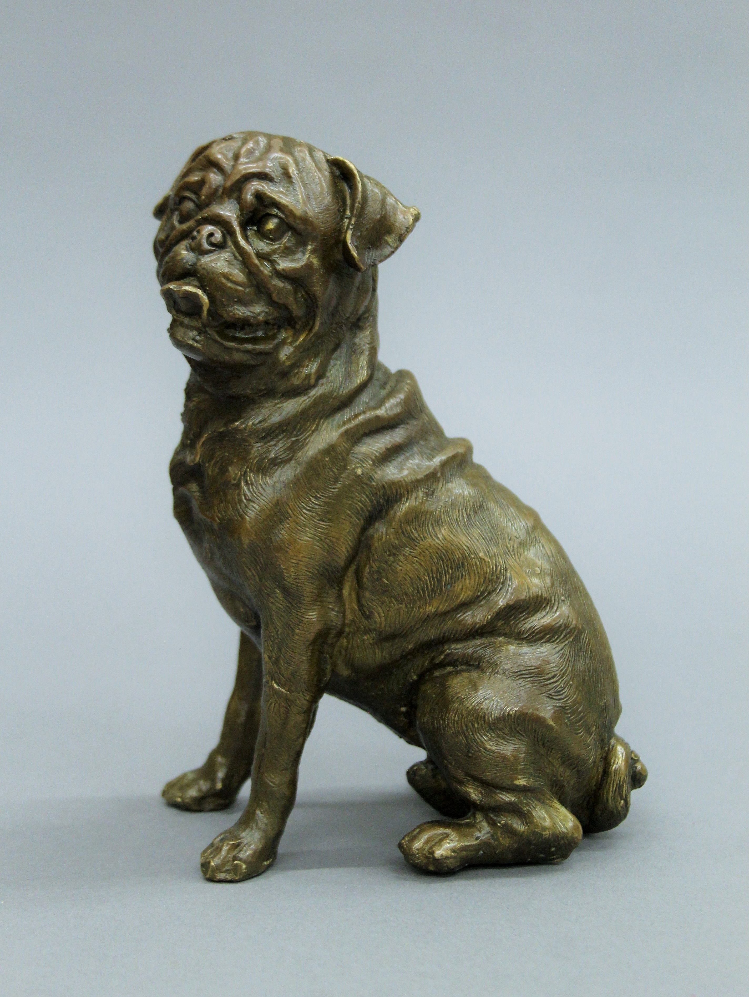 A bronzed figure of a German shepherd, signed Paul Herzel (1876-1956) and two bronze models of dogs. - Image 3 of 5