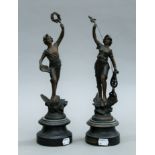 A pair of spelter figures. Each approximately 34 cm high.