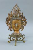 A bust of a deity set with cabochons. 29 cm high.