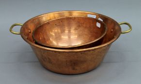 A copper preserve pan and a copper bowl. The former 43 cm wide.
