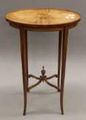 A Victorian satinwood side table. 46 cm long.