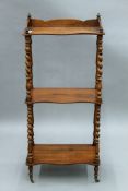 A Victorian rosewood three-tier whatnot. 51 cm wide.