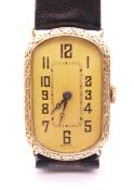 A 14 k gold cased Art Deco wristwatch. 2 cm wide. 18.9 grammes total weight.
