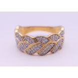 A silver gilt cubic zirconia ring. Ring size R/S.