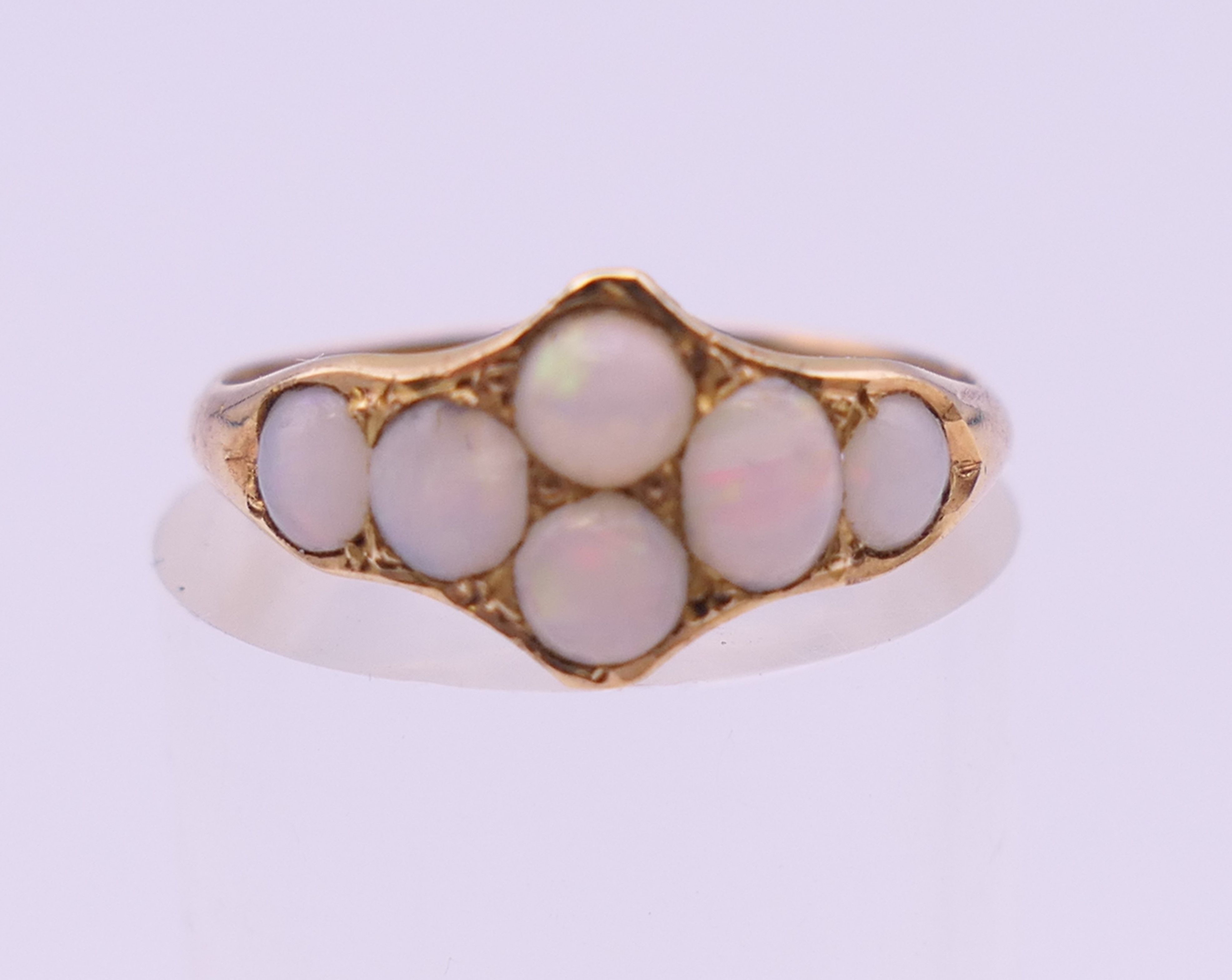 An unmarked gold opal set ring. Ring size K/L. 1.5 grammes total weight. - Image 2 of 5