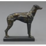 An antique spelter greyhound standing figure on a matching colour metal base. 18 cm high.