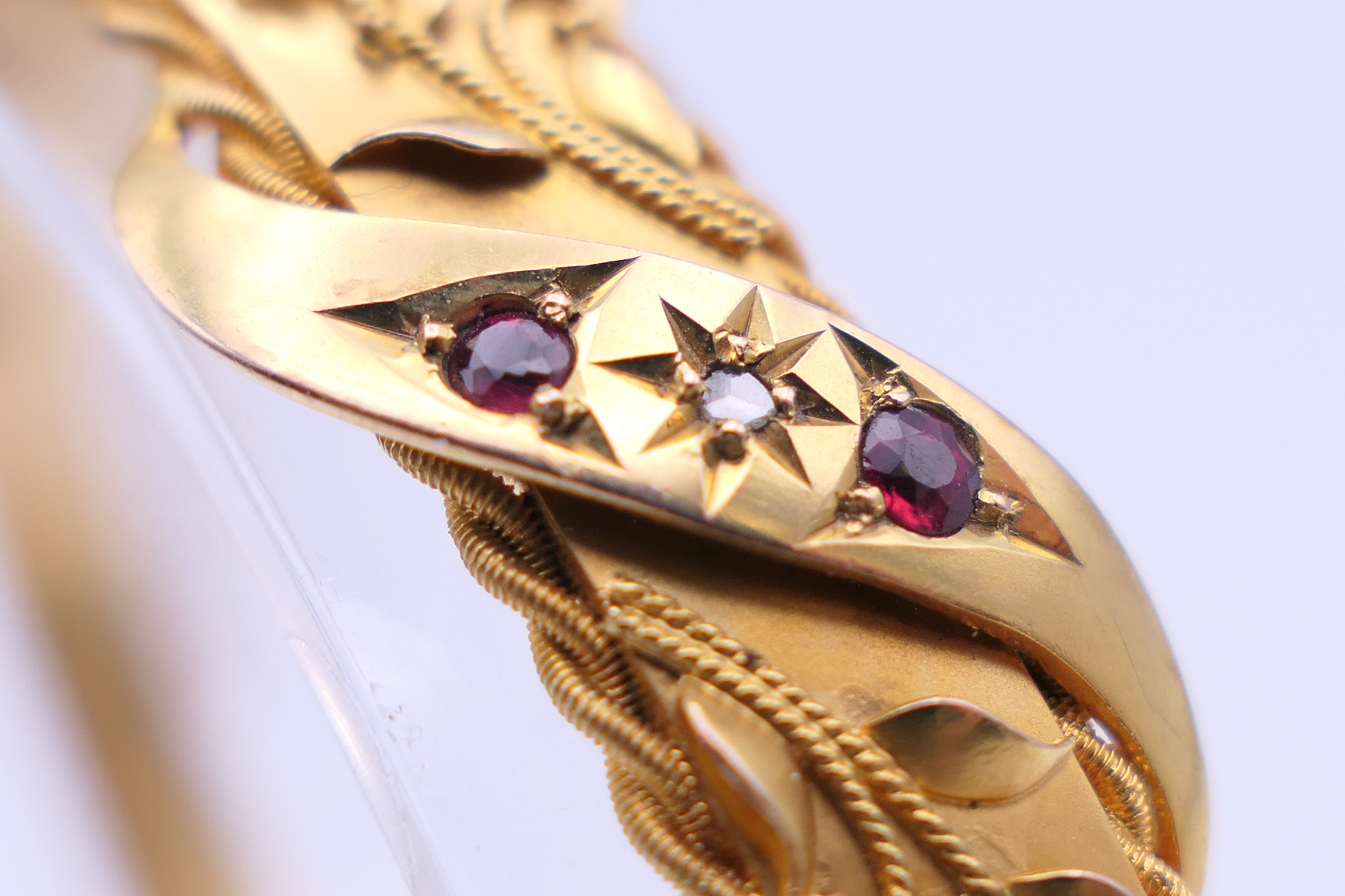 A 9 ct gold diamond and ruby bangle form bracelet. 6 cm internal diameter. 11. - Image 6 of 10