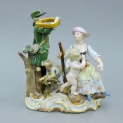 A late 19th century Meissen porcelain figural group of a huntsman, a woman and a cherub. 17.