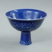 A Chinese dark blue porcelain stem cup. 11 cm high.