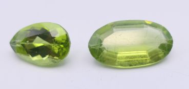 Two loose peridots. The largest 1.5 cm long.