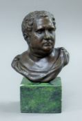 A small bronze bust of a gentleman on a plinth base. 14 cm high.