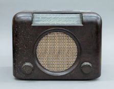 A Bush bakelite radio. 30 cms wide.