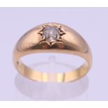 An 18 ct gold diamond gypsy set solitaire ring. Ring size O/P. 5.7 grammes total weight.