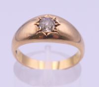 An 18 ct gold diamond gypsy set solitaire ring. Ring size O/P. 5.7 grammes total weight.