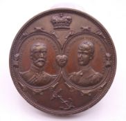 A bronze medallion commemorating the marriage of George and Mary, July 6th 1893,