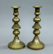 A pair of Georgian Scottish brass candlesticks,