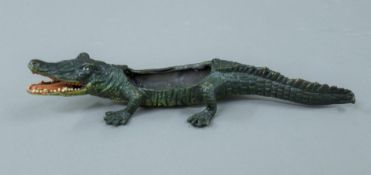 A cold painted bronze model of a crocodile. 21.5 cm long.