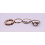 Four gold rings (one 14 K (2.4 grammes total weight), one 9 ct (3.