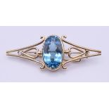 A large 9 ct gold blue stone (possibly aquamarine) brooch, circa 1900. 8 cm long, 3 cm high. 24.