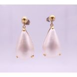 A pair of 18 K gold pearl set drop earrings, marked for Hirsch and Oppenheimer. 3 cm high. 4.