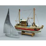 Two model boats. The largest 32 cm long.