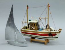 Two model boats. The largest 32 cm long.