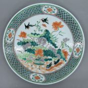 A 19th century Chinese famille verte porcelain charger. 37.5 cm diameter.