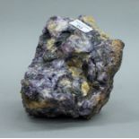 A mineral specimen, possibly Blue John. 16 cm high.