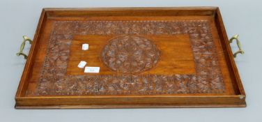 A carved mahogany tray. 59 cm wide.