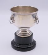 A silver miniature punch bowl trophy cup on stand. 10 cm high including stand.