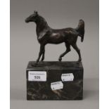 A bronze model of a horse on a marble plinth base. 19 cms high.