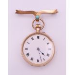 A 9 ct gold fob watch and a 9 ct gold turquoise set bow bar brooch.