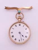 A 9 ct gold fob watch and a 9 ct gold turquoise set bow bar brooch.
