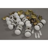 A quantity of porcelain and brass door and drawer handles.