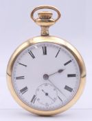 A gold plated open face pocket watch. 5 cm diameter.