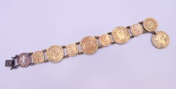 A bracelet formed with gilded coins. 20 cm long.