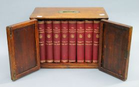 A cased set of Harmsworth Encyclopedia housed a mahogany box. 40 cms wide.