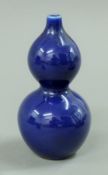 A small Chinese double gourd blue porcelain vase. 11 cm high.