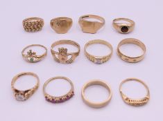 Twelve assorted rings (ten marked 9 ct, one marked 14 ct and one indistinct). 36.6 grammes.