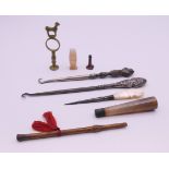 A quantity of miscellaneous items including button hooks, sewing stiletto, seals, etc.
