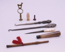 A quantity of miscellaneous items including button hooks, sewing stiletto, seals, etc.